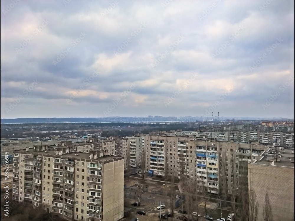 Fototapeta premium Thick, beautiful clouds above the high-rise buildings of the city.