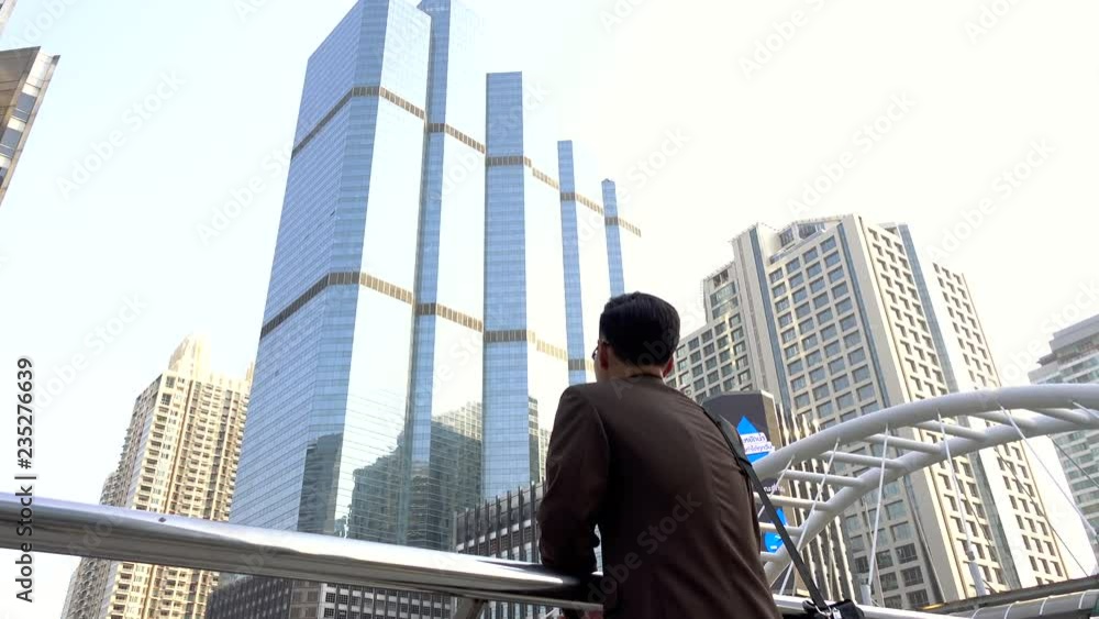 Business man looking forward to opportunity in modern city Business man looking forward to opportunity in modern city