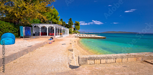 Idyllic turquoise beach and bar near Split panoramic view