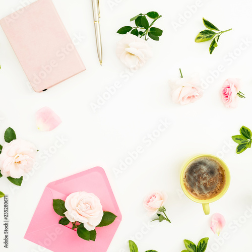 Valentines day composition with roses, paper envelope, notebook and mug of cappuccino white background. Flat lay, top view. Frame with copy space