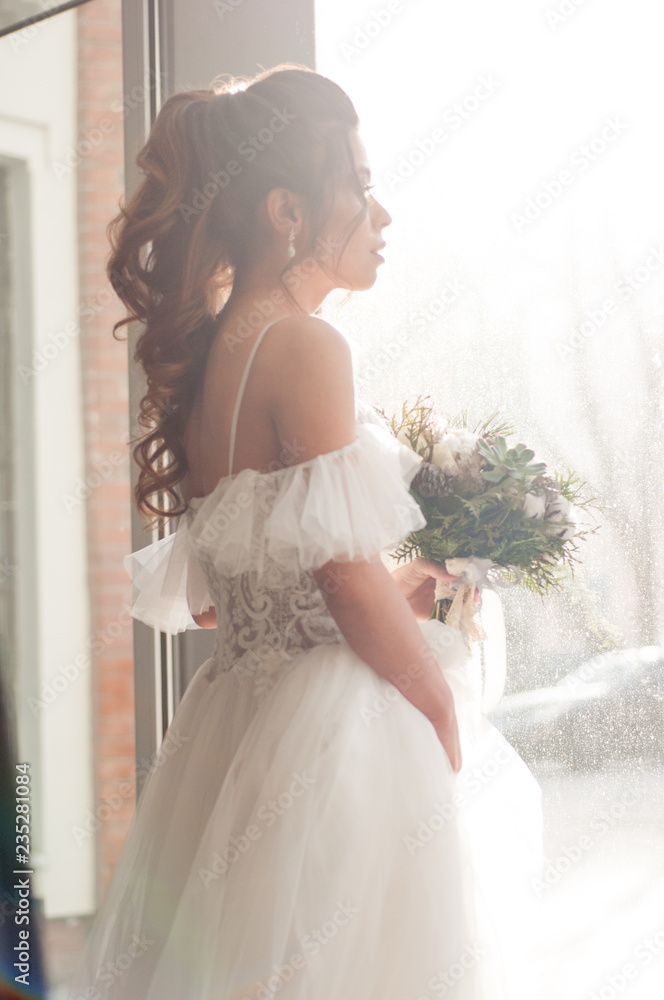 bride with dark hair in a white wedding dress with bride with dark hair in a white wedding dress with