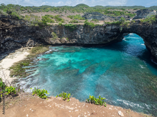 Beautiful natural sea pool Broken Bay. Bali travel destination. Nusa Penida island day tour popular place. Activity on beach holiday with kids. Indonesia  october  2018