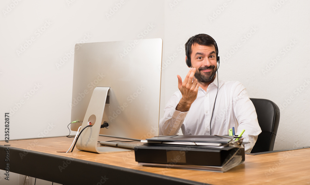 Telemarketer man in a office inviting to come with hand. Happy that you came Telemarketer man in a office inviting to come with hand. Happy that you came