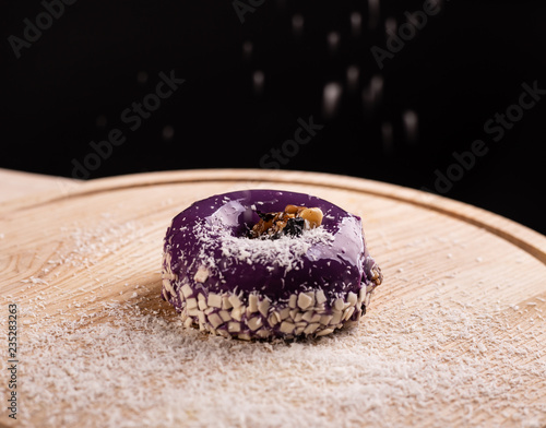 Sweet tasty donut on the board photo