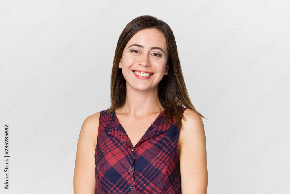 Amazing and cheerful smiling brunette woman in beautiful dress studio shot, isolated on white Amazing and cheerful smiling brunette woman in beautiful dress studio shot, isolated on white