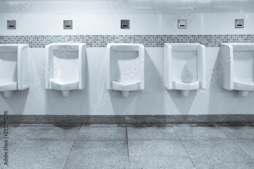 Row of urinals in men's bathroom
