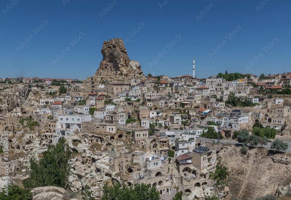 Obraz premium Uçhisar, Turkey - A Unesco World Heritage site, Cappadocia is famous for its fairy chimneys, churches and castles carved in the rock, and a unique heritage