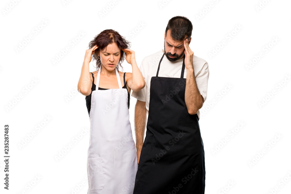 Couple of cooks unhappy with something. Negative facial expressi on isolated white background Couple of cooks unhappy with something. Negative facial expressi on isolated white background