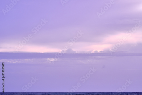 Fototapeta Naklejka Na Ścianę i Meble -  Beautiful clouds over the ocean surface after the sunset. Natural background.