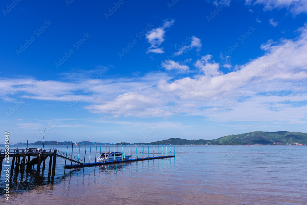 speed boat at port with blue sea and sky background