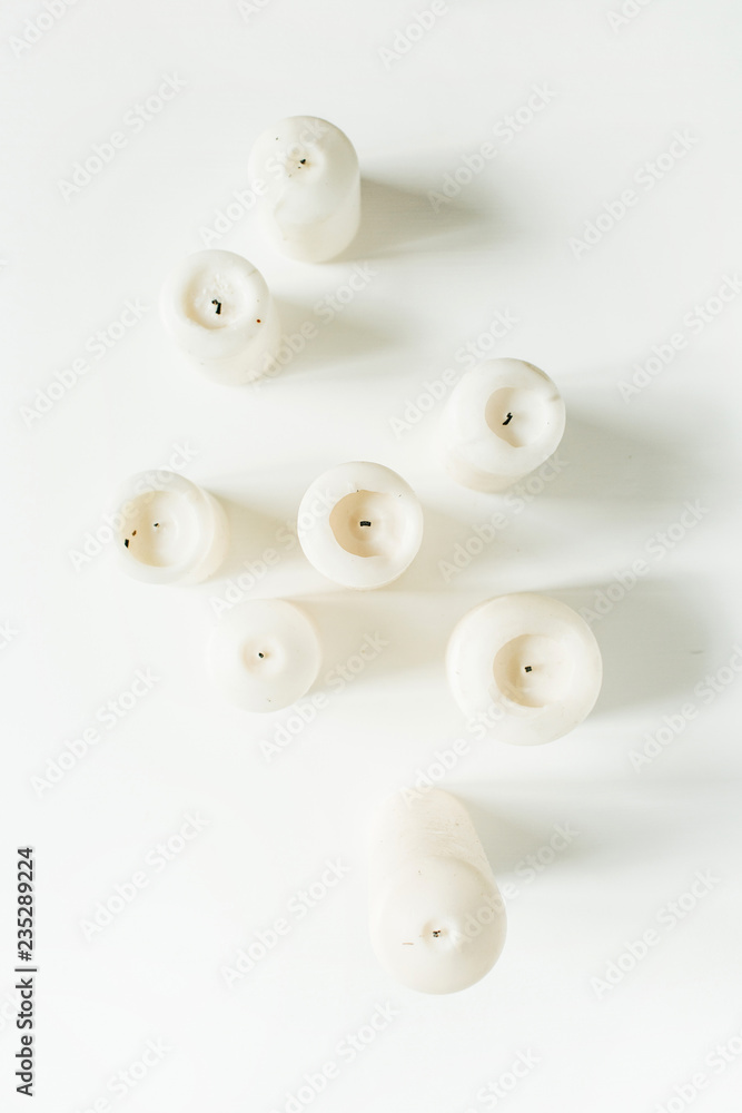 Candles on white background. Flat lay, top view. Candles on white background. Flat lay, top view.