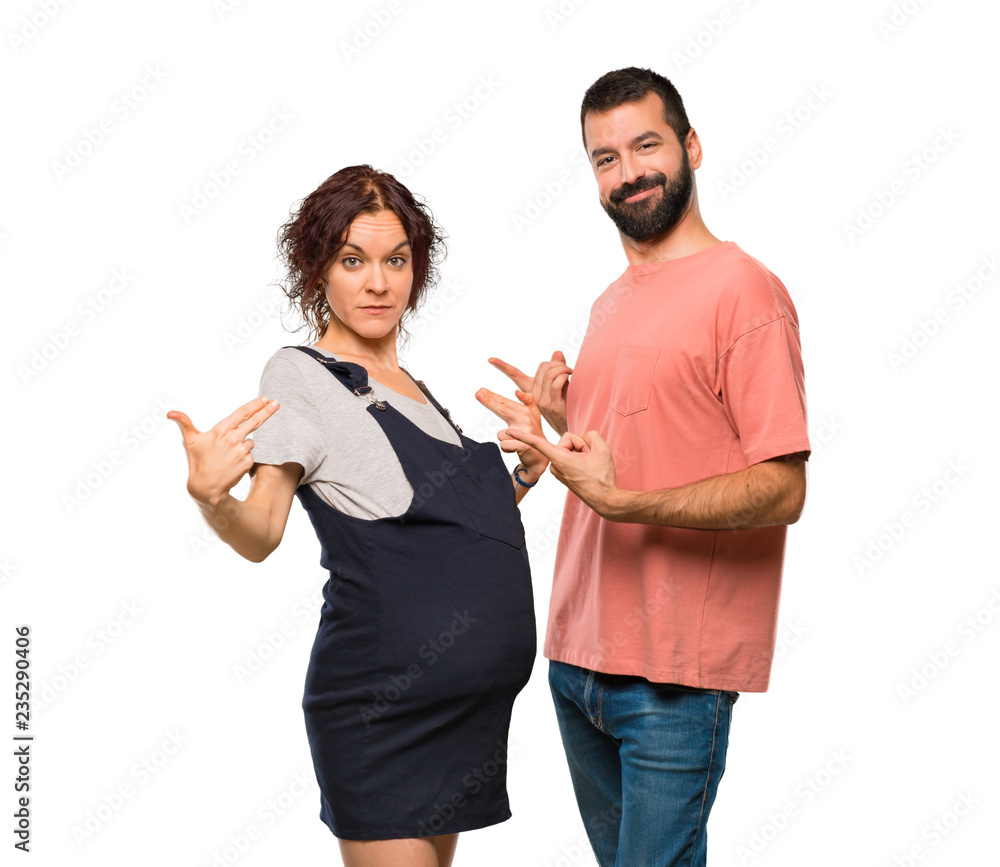 Couple with pregnant woman proud and self-satisfied in love yourself concept on isolated white background Couple with pregnant woman proud and self-satisfied in love yourself concept on isolated white background