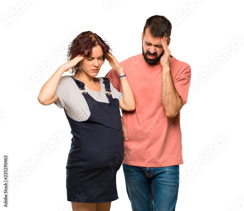 Couple with pregnant woman unhappy with something. Negative facial expression on isolated white background