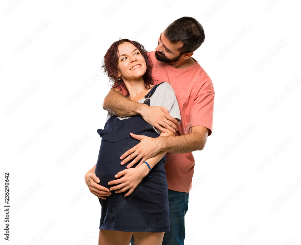 Couple with pregnant woman hugging on isolated white background Couple with pregnant woman hugging on isolated white background