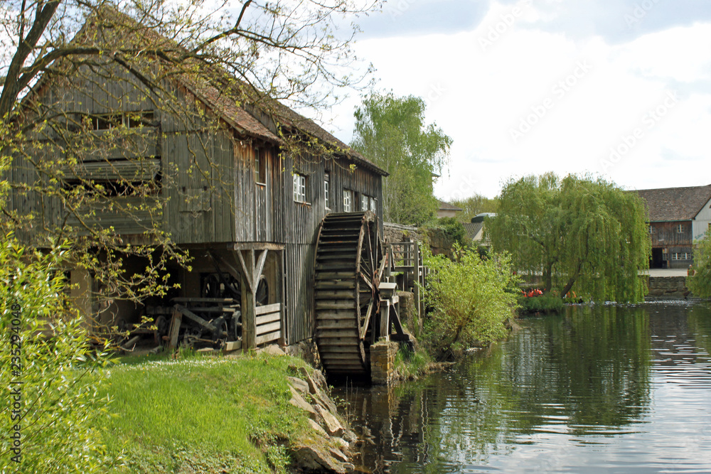 Wassermühle an einem Fluss im Elsass Wassermühle an einem Fluss im Elsass