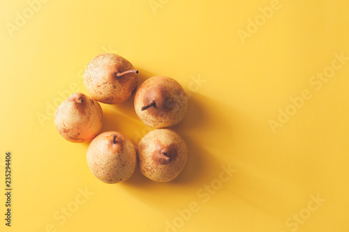 Set of pears in orange background photo