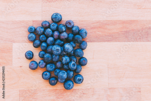 Heap of blueberries on parquet
