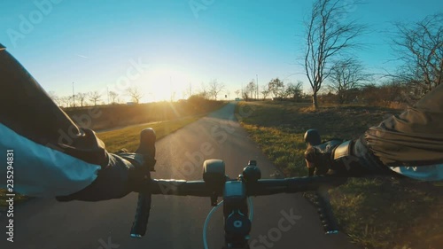 Road racing on smalle road with bicycle seen from the pPOV of the cyclist photo