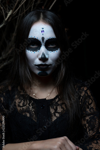 Portrait of girl with make-up skeleton on her face. Halloween. 