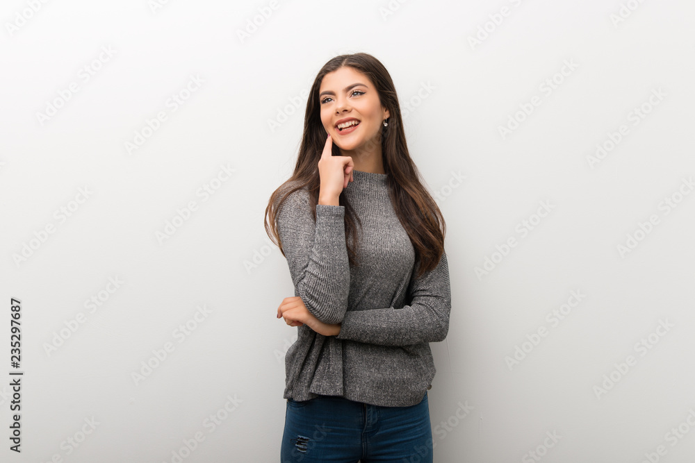 Teenager girl on isolated white backgorund thinking an idea while looking up Teenager girl on isolated white backgorund thinking an idea while looking up