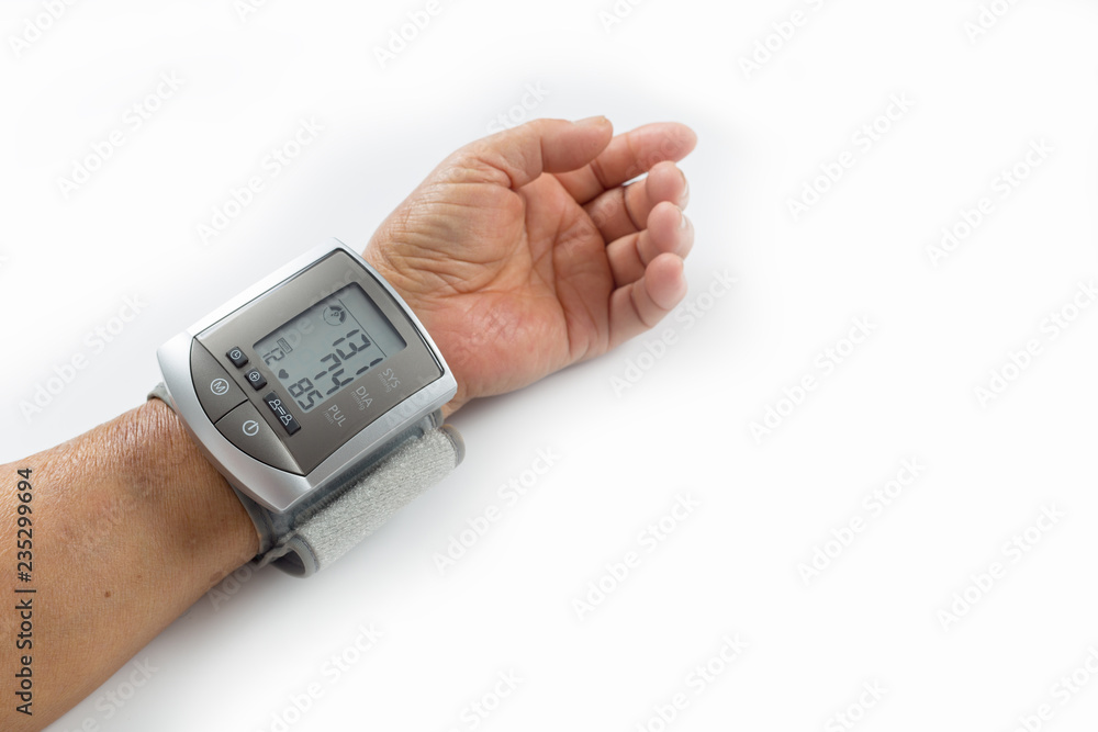 Old asian man is checking his blood pressure with monitor by himself at home. Old asian man is checking his blood pressure with monitor by himself at home.