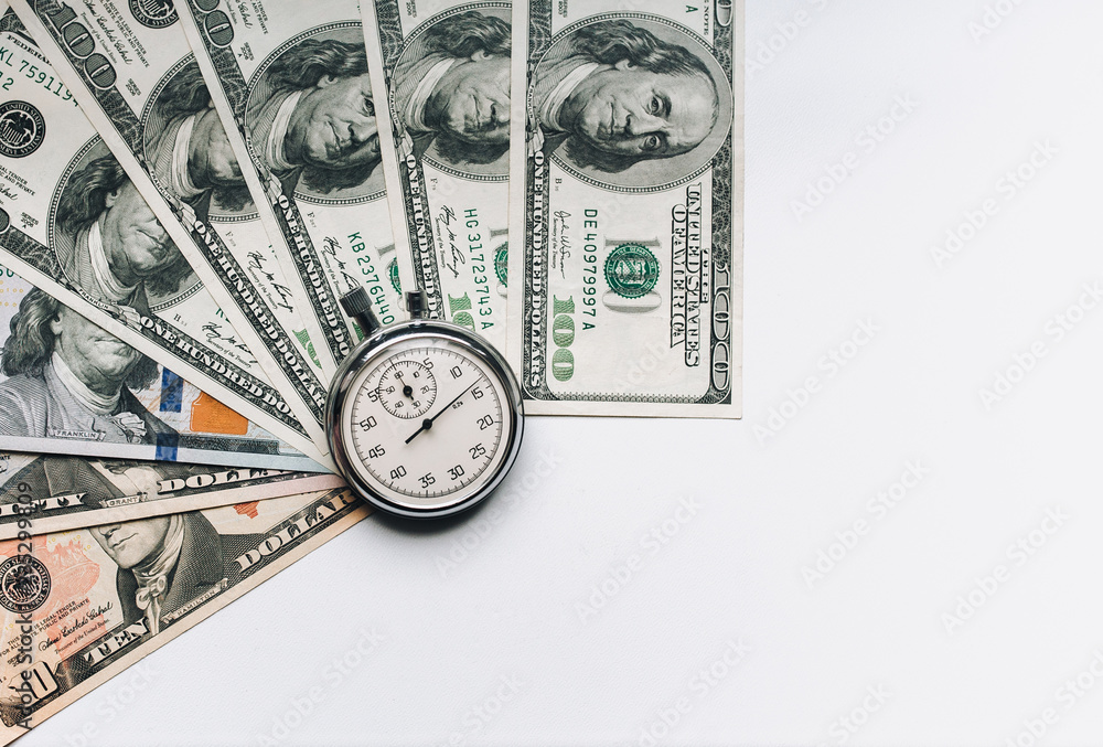 Stopwatch and dollars. Time is money concept. Banknotes and coins. Money loan. Credit debt. Copy space. Stopwatch and dollars. Time is money concept. Banknotes and coins. Money loan. Credit debt. Copy space.