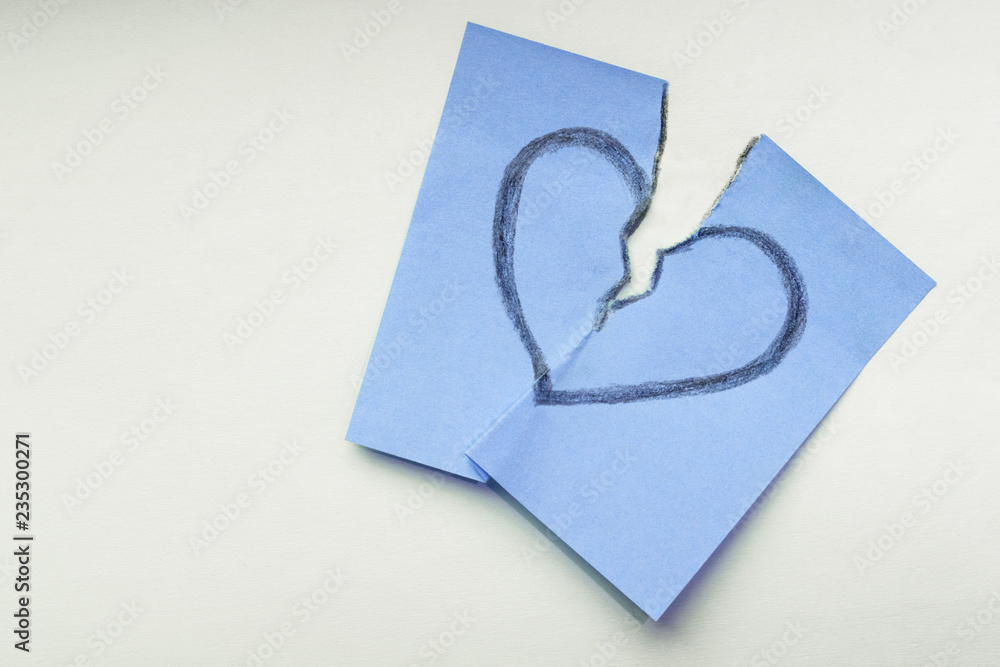 Φωτογραφία broken heart painted on blue sticker as a symbol of unlucky love