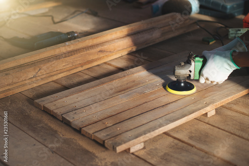 Carpenter used wood polishing machine.