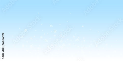 Sparse glowing snow Christmas background. Subtle f
