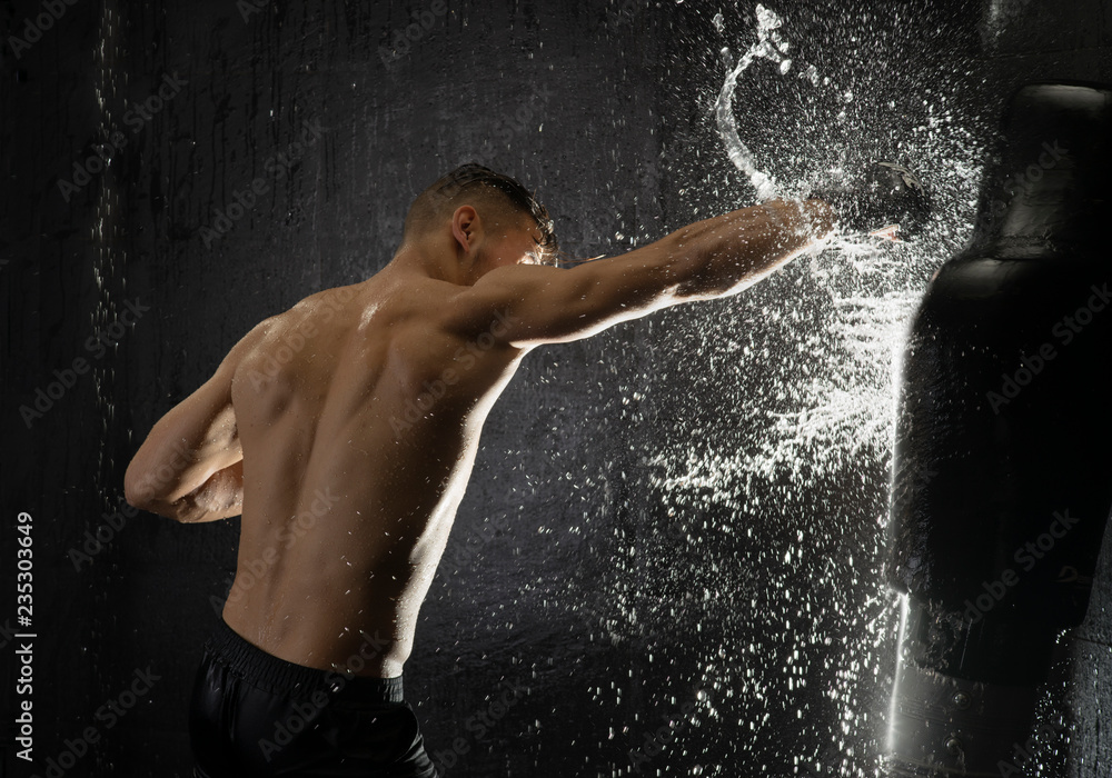 Fototapeta premium Boxer with water bag 
