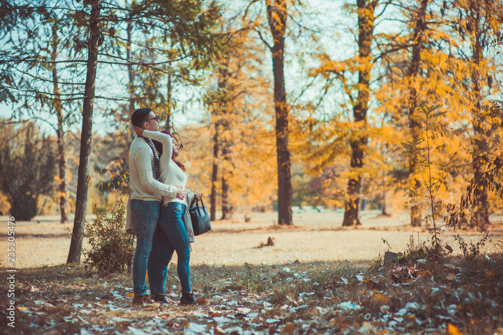 Two people in love admiring the view of the wood Two people in love admiring the view of the wood