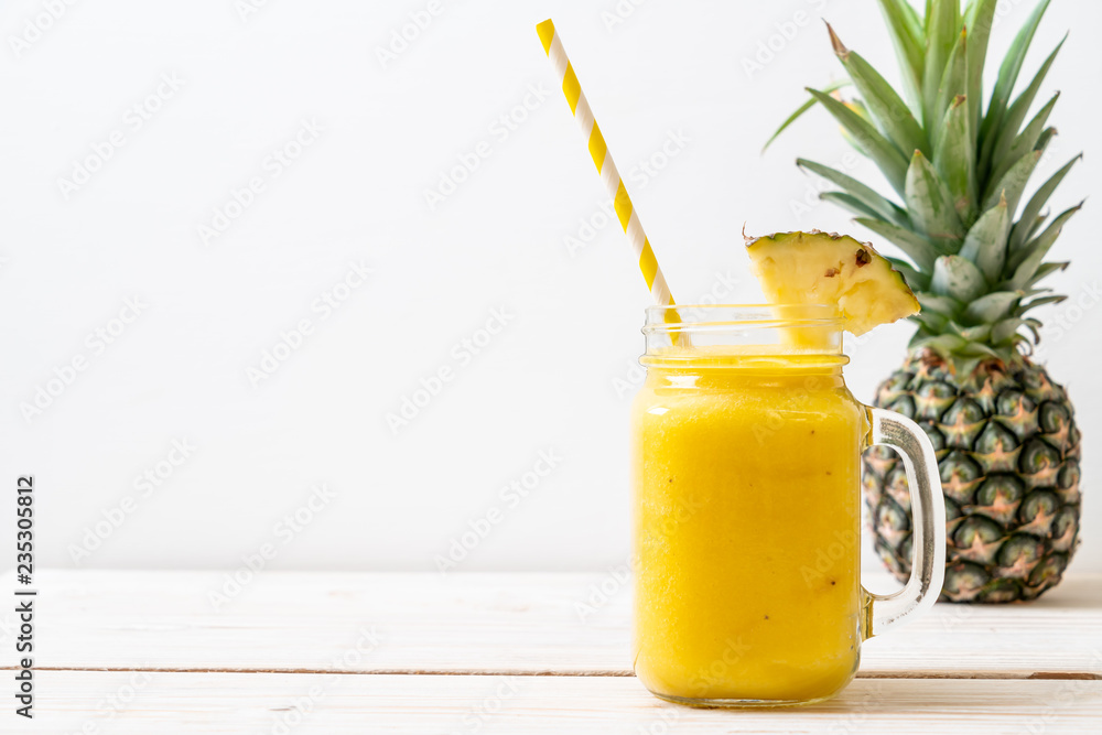 fresh pineapple smoothie glass on wood table fresh pineapple smoothie glass on wood table