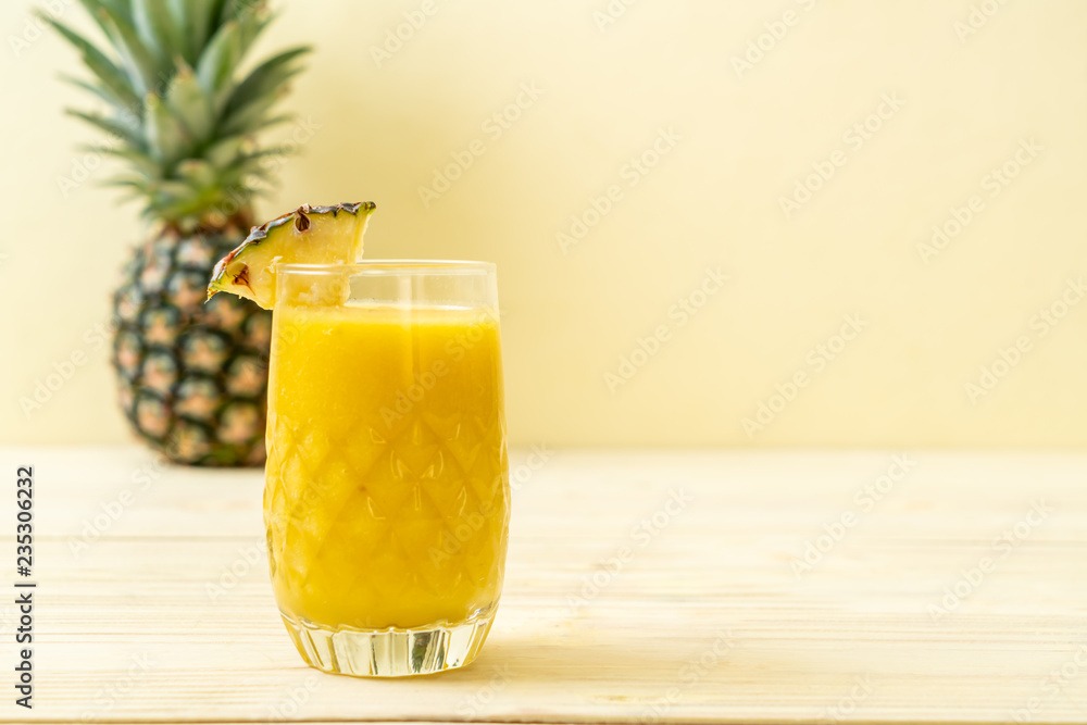 fresh pineapple smoothie glass on wood table fresh pineapple smoothie glass on wood table