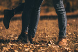 Urban couple wearing jeans and boots in autumn