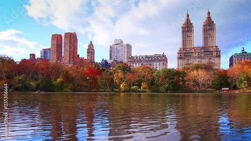 New York City Central Park in Autumn with skyscrapers apartment boat and lake
