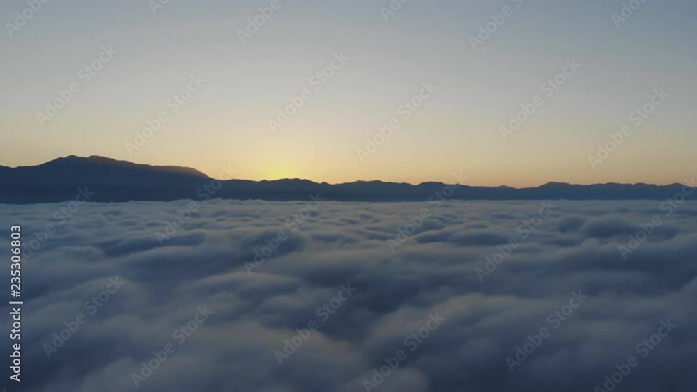 Landscape of Morning Mist with Mountain Layer at north of Thailand. Aerial View. Flying over the high mountains in beautiful clouds . Aerial video shot. Landscape of Morning Mist with Mountain Layer at north of Thailand. Aerial View. Flying over the high mountains in beautiful clouds . Aerial video shot.