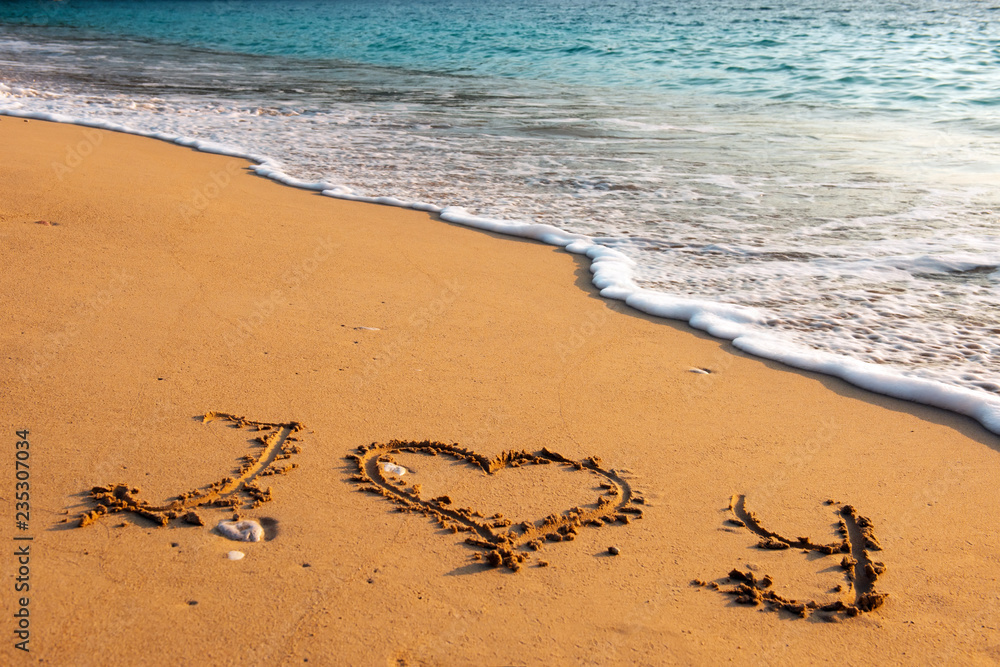 Fototapeta premium Message i love you on sand beach