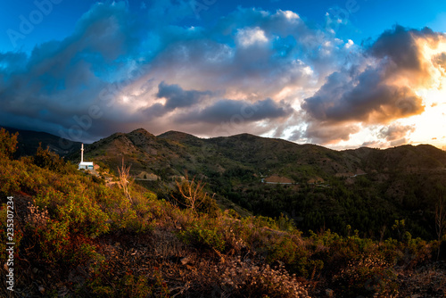 Troodos mountainscape with the Holy Cross church at the top of the Fidkias hill. Pedoulas village  Nicosia District  Cyprus