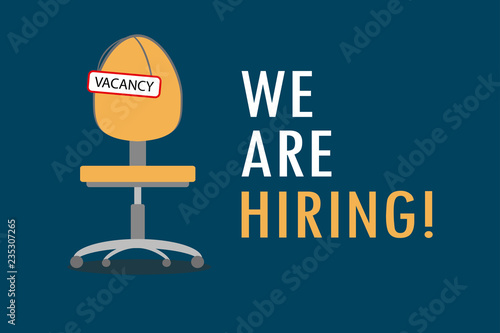 Office chair with sign vacancy.Tagline We Are Hiring