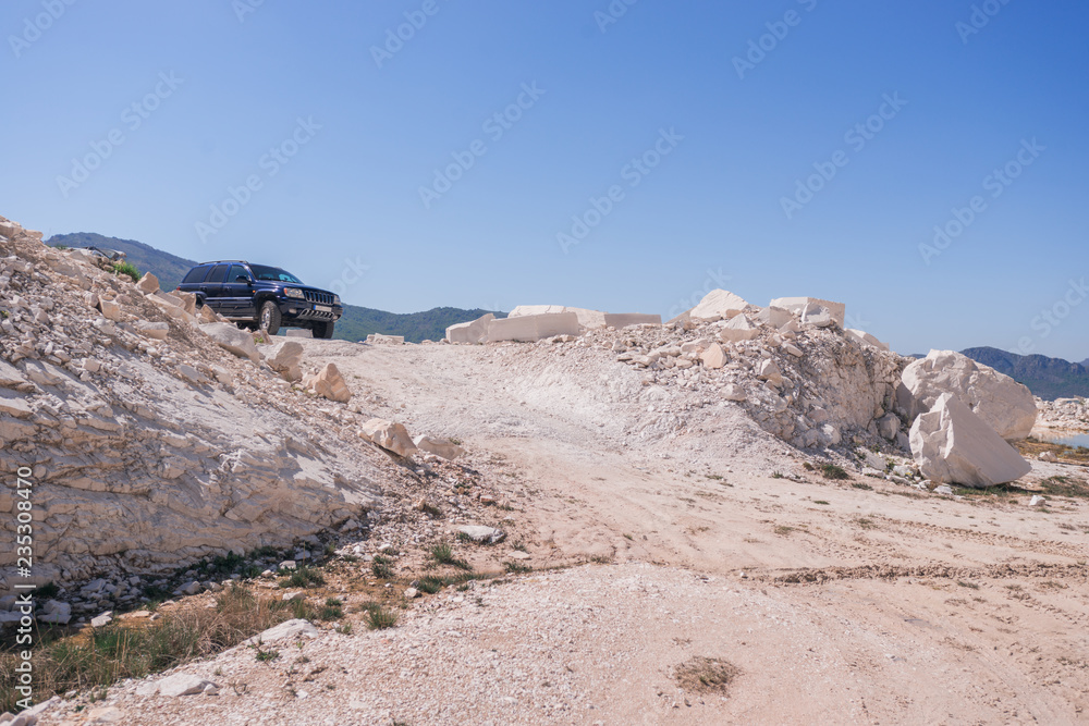 off road vehicle in marble quarry