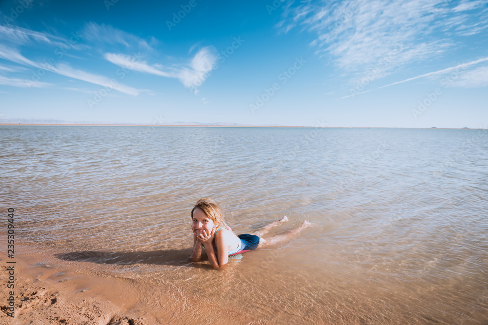 Little girl on beautiful ocean beach Little girl on beautiful ocean beach