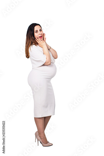 surprised pregnant woman in a white dress. The pregnant businesswoman isolated on white. © Marina Varnava