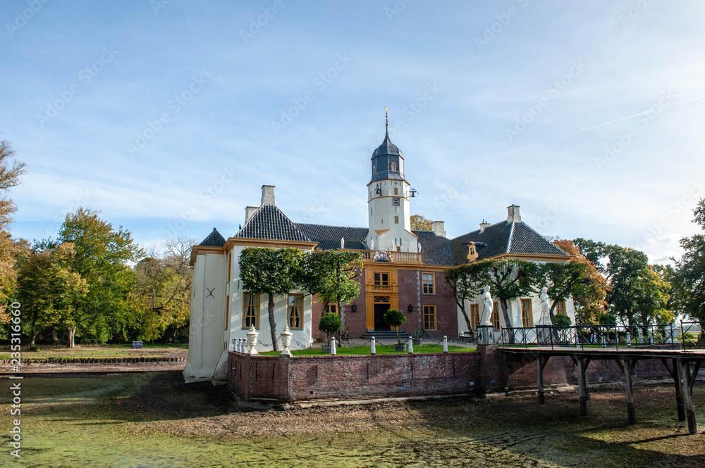 Fototapeta premium Exterior of a historic palace in the Dutch Province of Groningen, known as Fraeylemaborg. Impression from an early autumn afternoon.