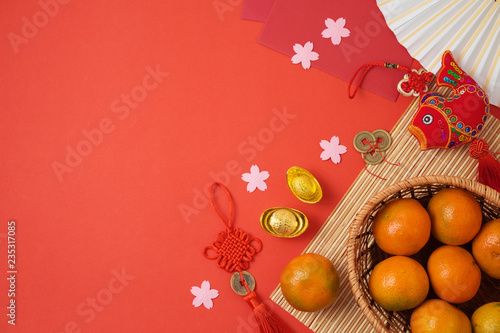 Chinese New Year background with traditional decorations for Spring festival on red table