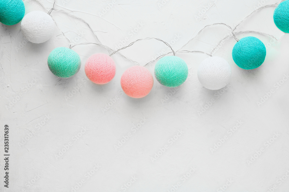 Multi-colored balls on a white background, close-up, flatlay, copyspase