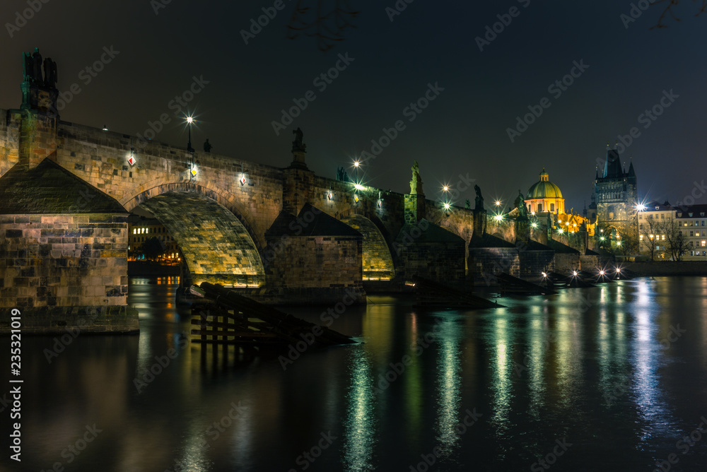View of the Charles Bridge and Vltava river in Prague in a cold winter night - 1
