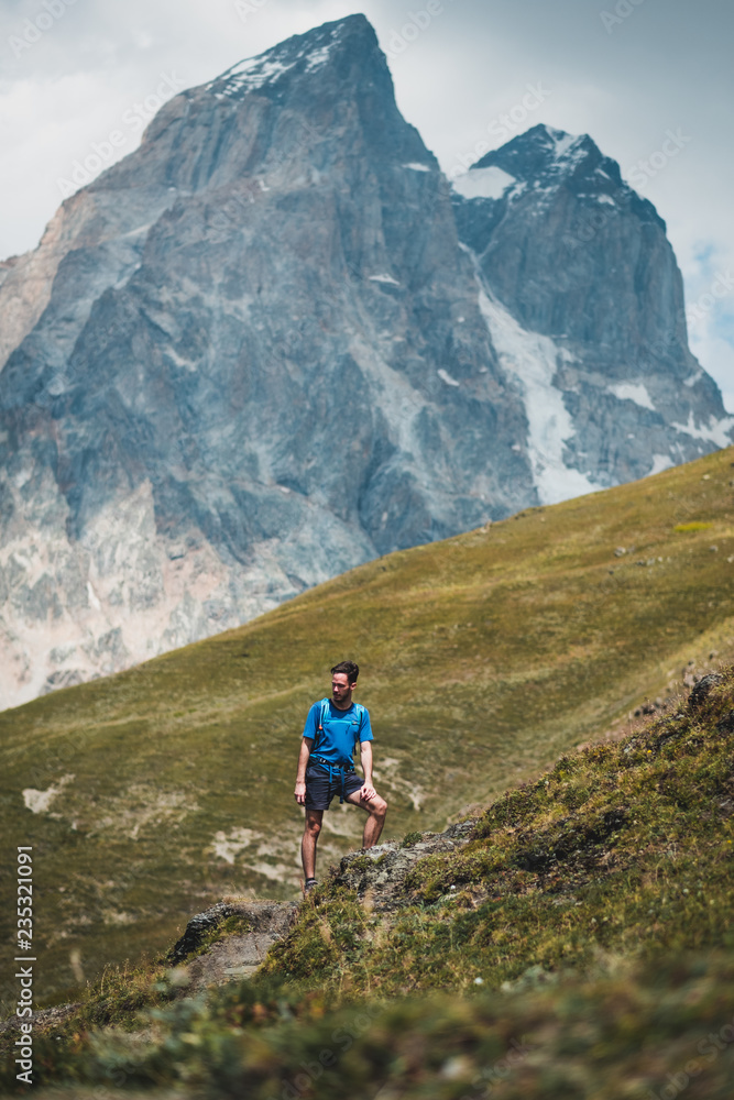 young man hiking in the mountains of Georgia, Caucasus mountain