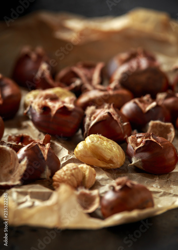 Roasted chestnuts served on crumpled paper