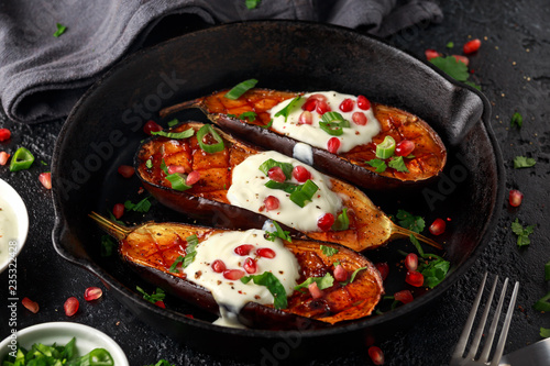 Cooked eggplants with yogurt sauce and pomegranate seeds, pars