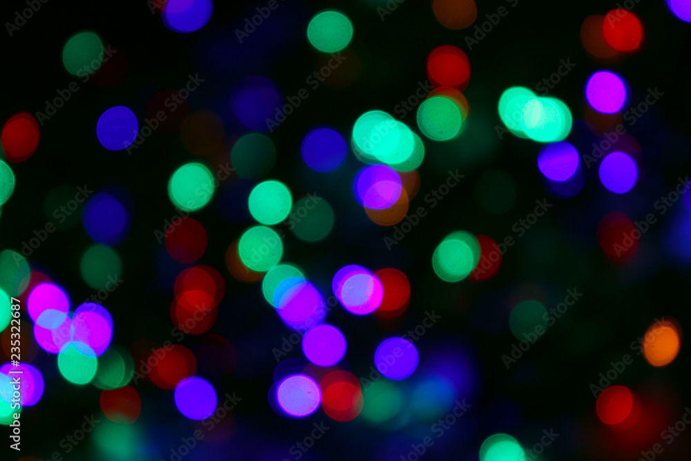 Abstract Multicolors Background. Colorful Abstract Background. Colorful Texture. Blurred Image Of Colorful Lights. Blurred Christmas Lights On Dark Background. Blurred Image.

